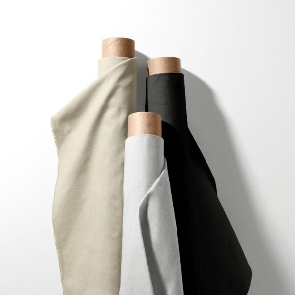 Bulk calico cotton fabric rolls in Natural, black and optic white. Affordable premium quality from cotton wholesaler UK