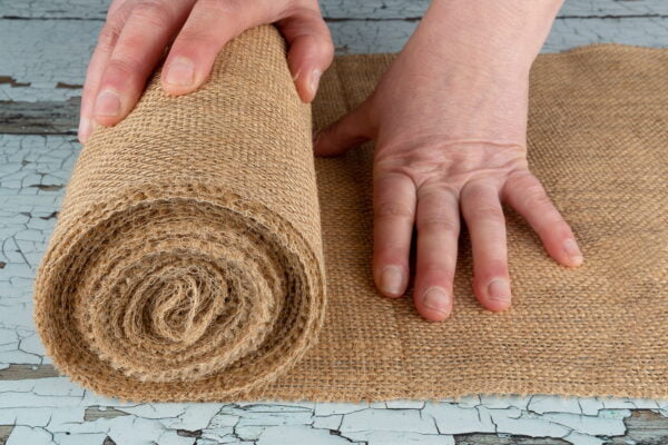 Jute Table Runner Rolling action image 3rd person